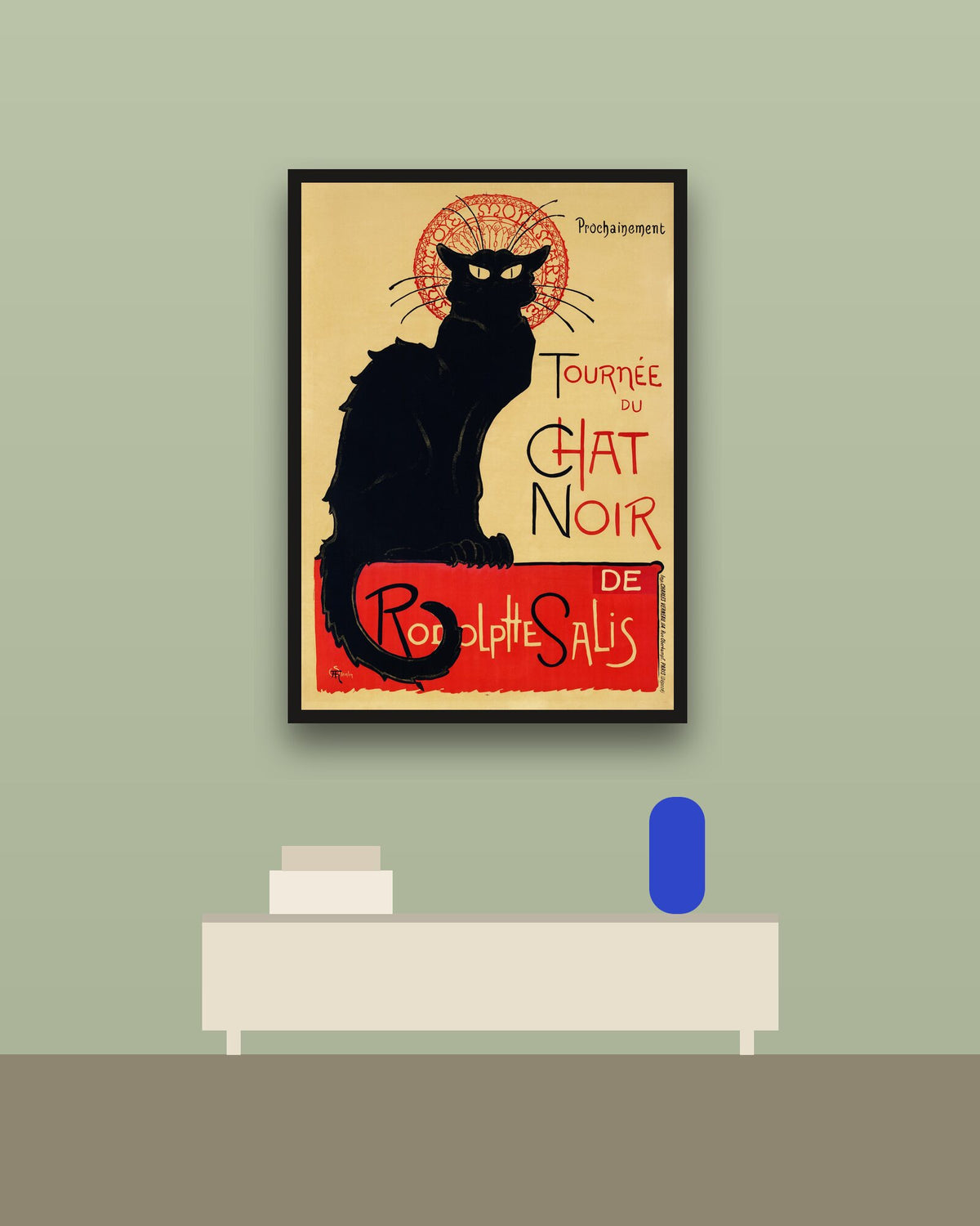 Le Chat Noir en una pared verde con marco negro (imagen ilustrativa)