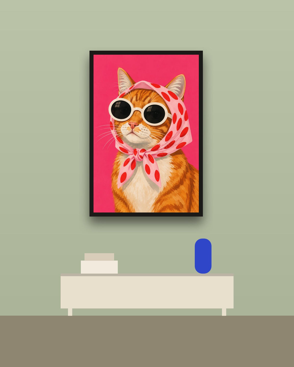 Gata con pañuelo en una pared verde con marco negro (imagen ilustrativa)
