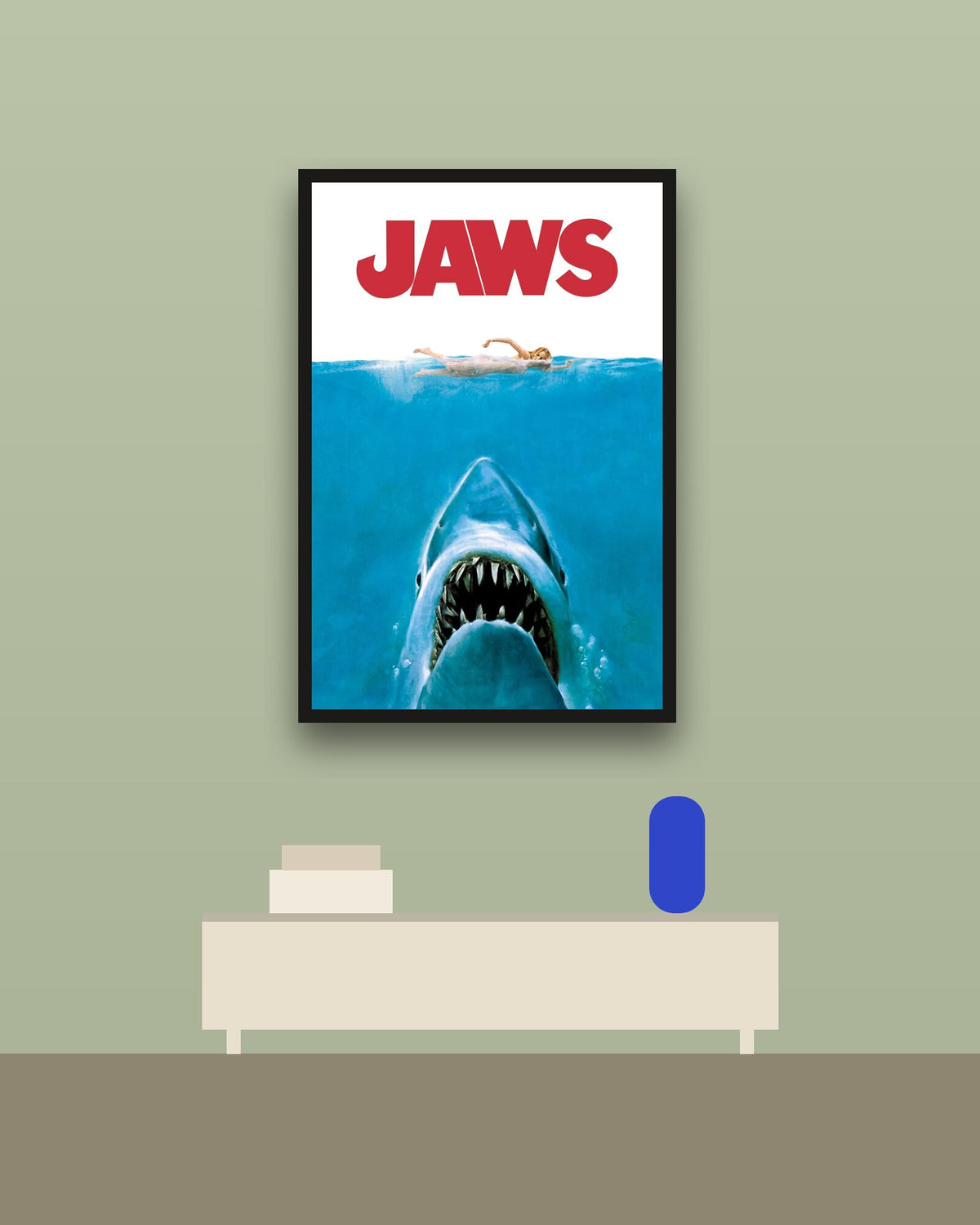 Jaws en una pared verde con marco negro (imagen ilustrativa)