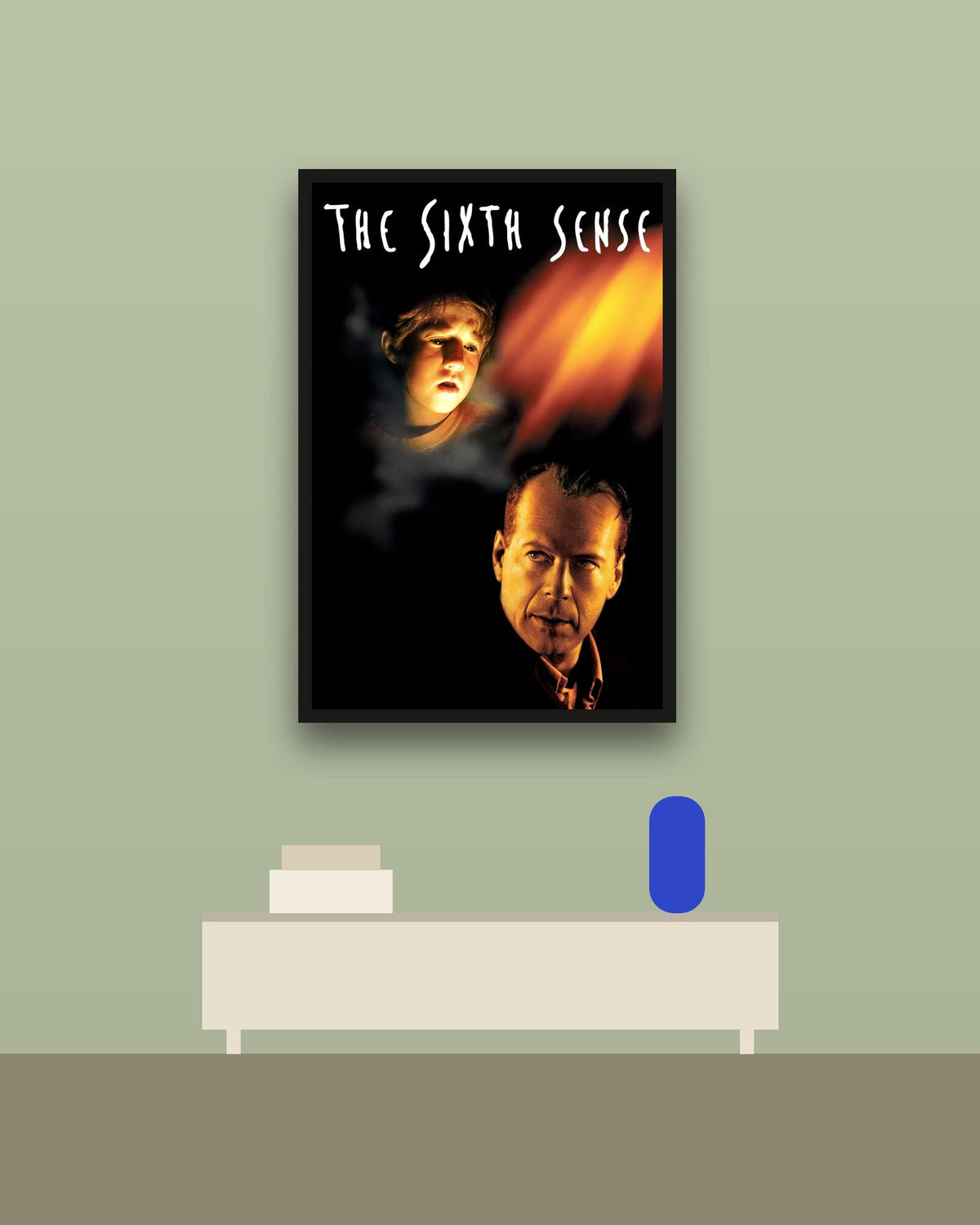The Sixth Sense en una pared verde con marco negro (imagen ilustrativa)