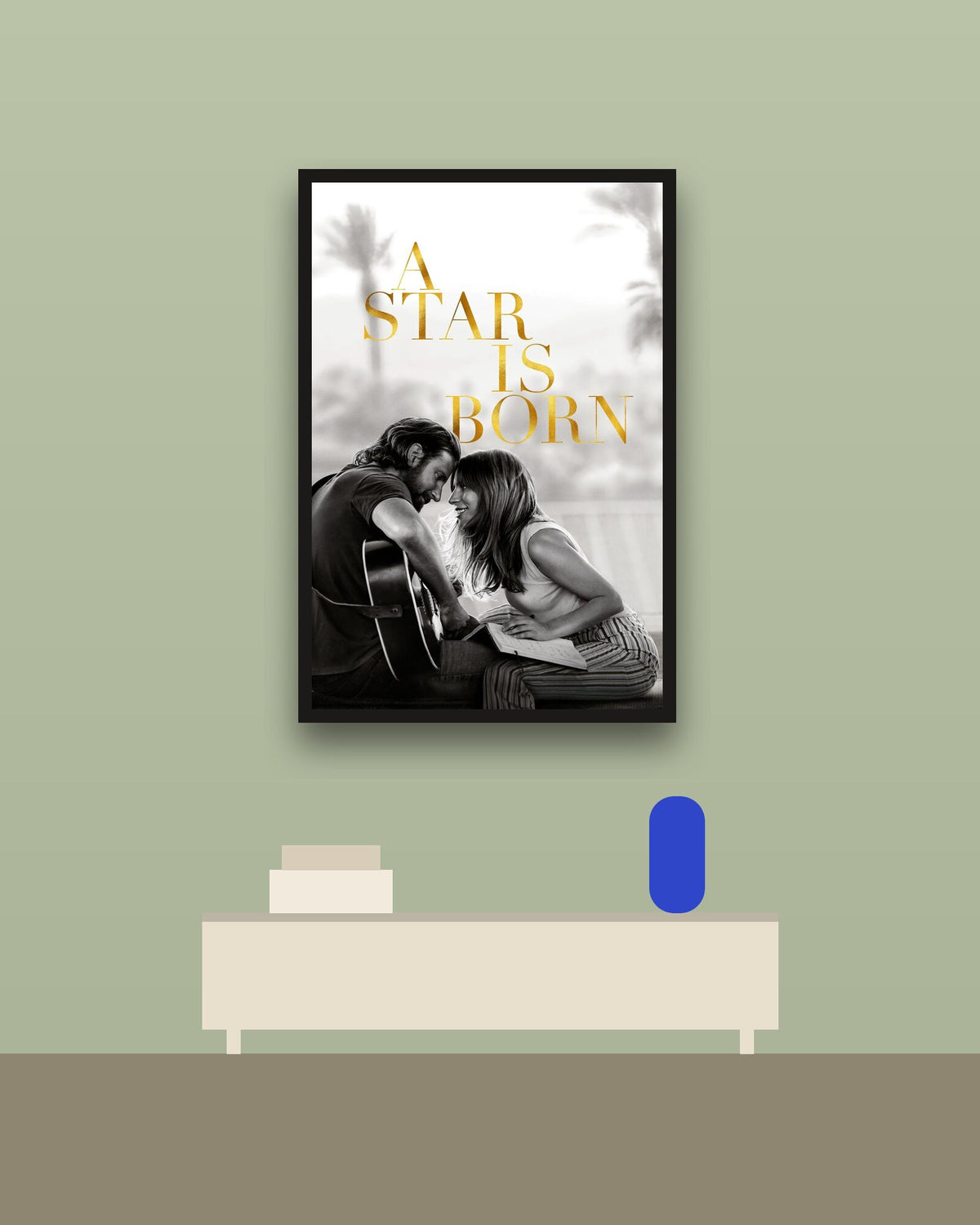 A Star Is Born en una pared verde con marco negro (imagen ilustrativa)